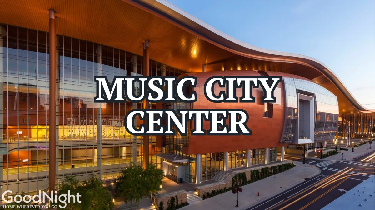 The image features the distinctive Music City Center building with its unique curved roof structure and expansive glass windows, set against the vibrant surroundings of downtown Nashville. The area is bustling with activity, capturing the energy of a major events and convention hub just moments from Artpop.